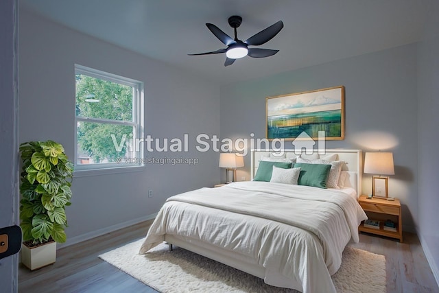 1719 Wagon Gap Trl, Houston, TX 77090 - bedroom featuring wood finished floors, baseboards, and ceiling fan