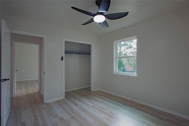 1719 Wagon Gap Trl, Houston, TX 77090 - unfurnished bedroom featuring light wood-style flooring, a closet, and baseboards