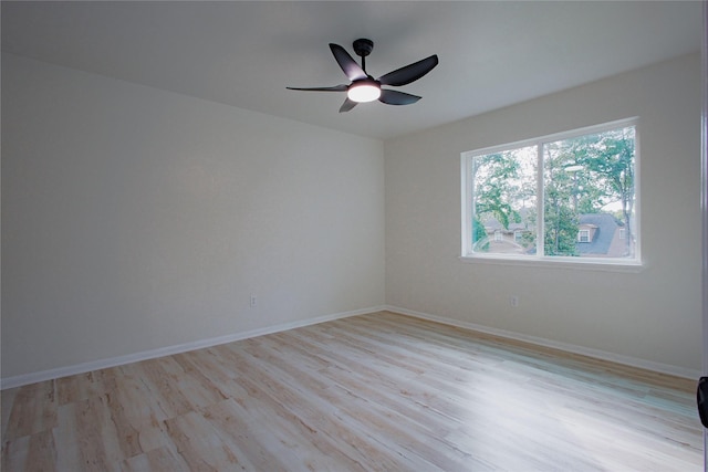 1719 Wagon Gap Trl, Houston, TX 77090 - spare room with light wood-type flooring, ceiling fan, and baseboards