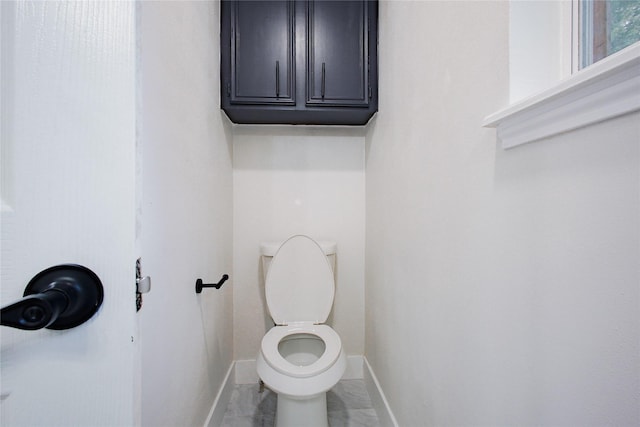 1719 Wagon Gap Trl, Houston, TX 77090 - bathroom with baseboards and toilet