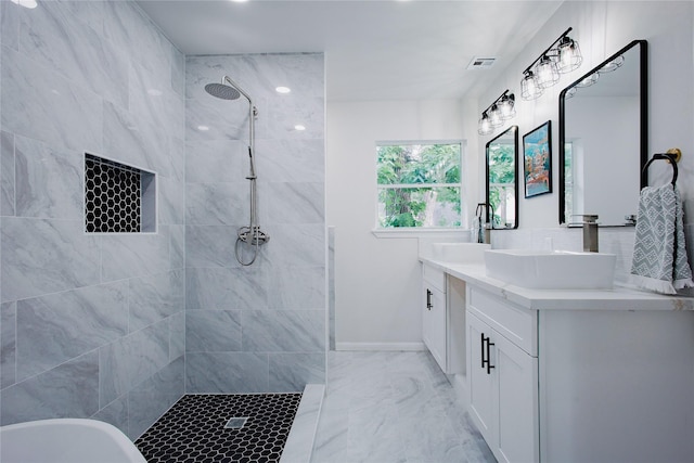 1719 Wagon Gap Trl, Houston, TX 77090 - bathroom with marble finish flooring, tiled shower, double vanity, baseboards, and a freestanding bath