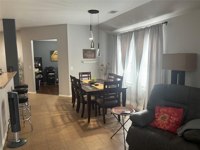16427 Kettlebrook Ln, Houston, TX 77049 - dining area with light tile patterned floors and visible vents