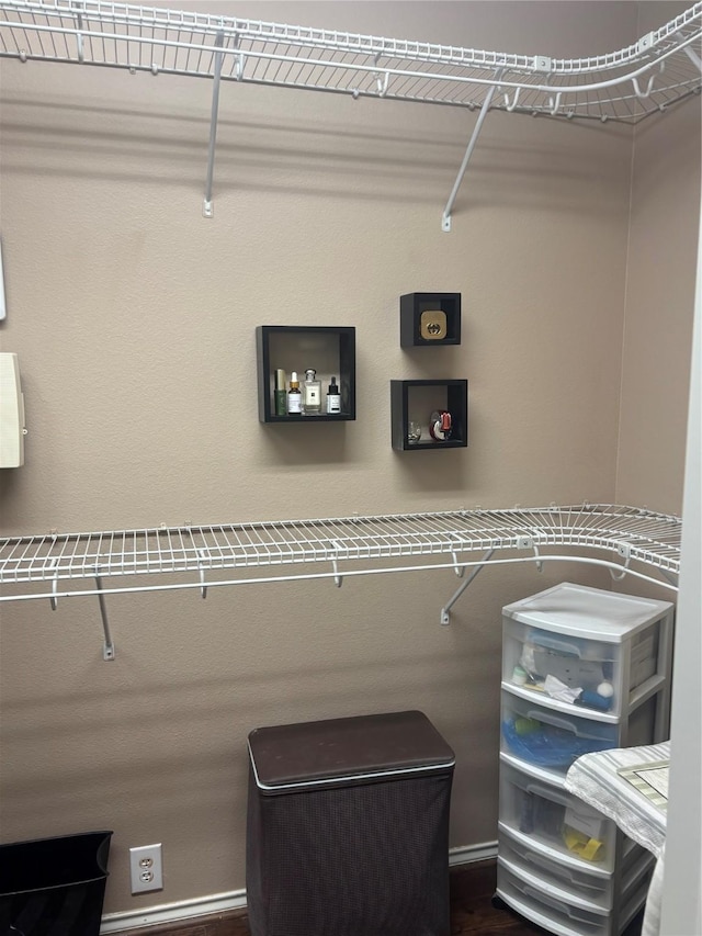 16427 Kettlebrook Ln, Houston, TX 77049 - walk in closet with dark wood-type flooring