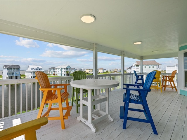 4035 Estuary Ct, Galveston, TX 77554 - wooden terrace featuring a residential view and a water view