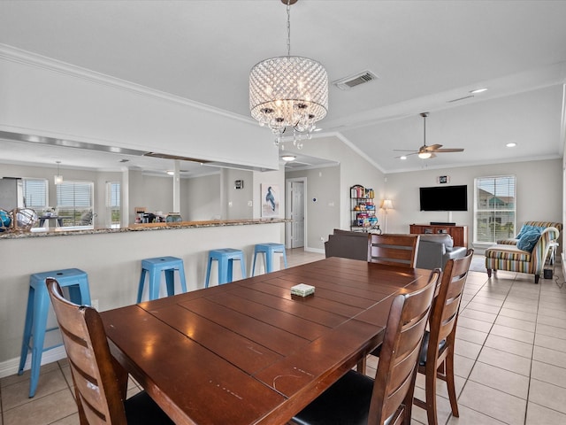 4035 Estuary Ct, Galveston, TX 77554 - dining area featuring a chandelier, light tile patterned floors, ceiling fan, crown molding, and lofted ceiling