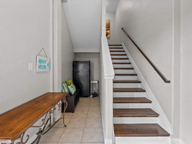 4035 Estuary Ct, Galveston, TX 77554 - stairs with tile patterned flooring and lofted ceiling