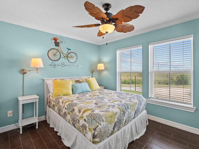 4035 Estuary Ct, Galveston, TX 77554 - bedroom with baseboards, crown molding, wood tiled floors, and ceiling fan