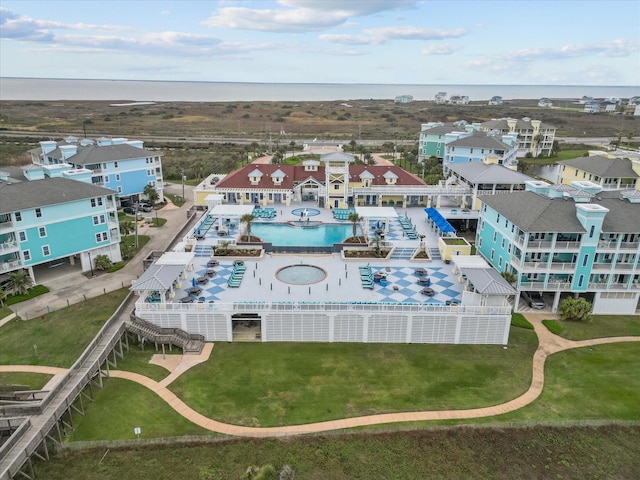 4035 Estuary Ct, Galveston, TX 77554 - drone / aerial view of a pool and a large body of water