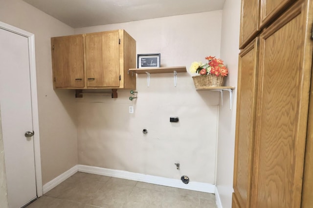 1217 E Brown Ln, Deer Park, TX 77536 - washroom with hookup for an electric dryer, cabinet space, baseboards, gas dryer hookup, and light tile patterned floors