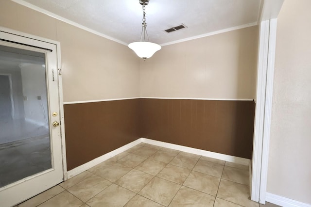 1217 E Brown Ln, Deer Park, TX 77536 - unfurnished dining area with ornamental molding, a wainscoted wall, and baseboards