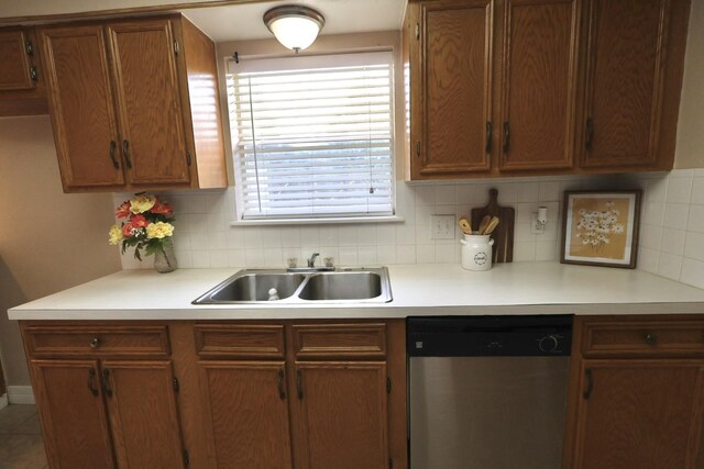 1217 E Brown Ln, Deer Park, TX 77536 - kitchen with dishwasher, a sink, backsplash, and light countertops