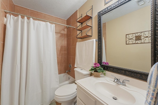 13935 Pueblo Run, Cypress, TX 77429 - bathroom featuring vanity, shower / tub combo with curtain, visible vents, toilet, and a textured ceiling
