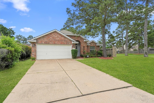 13935 Pueblo Run, Cypress, TX 77429 - view of front of home featuring driveway, a garage, brick siding, fence, and a front lawn