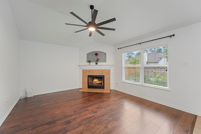 13935 Pueblo Run, Cypress, TX 77429 - unfurnished living room with a tiled fireplace, a ceiling fan, wood finished floors, and vaulted ceiling