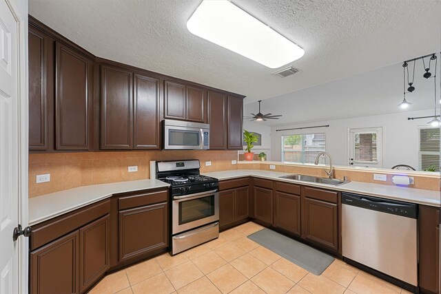 13935 Pueblo Run, Cypress, TX 77429 - kitchen featuring light countertops, appliances with stainless steel finishes, a sink, and visible vents