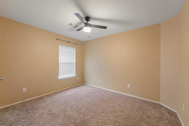 13935 Pueblo Run, Cypress, TX 77429 - empty room with ceiling fan, carpet floors, a textured ceiling, baseboards, and visible vents