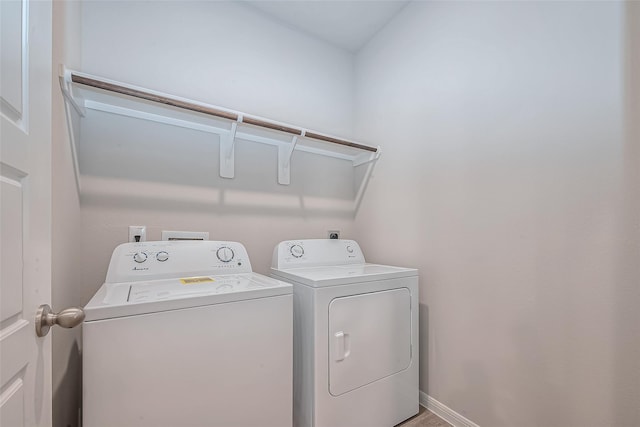 clothes washing area featuring laundry area and washing machine and clothes dryer