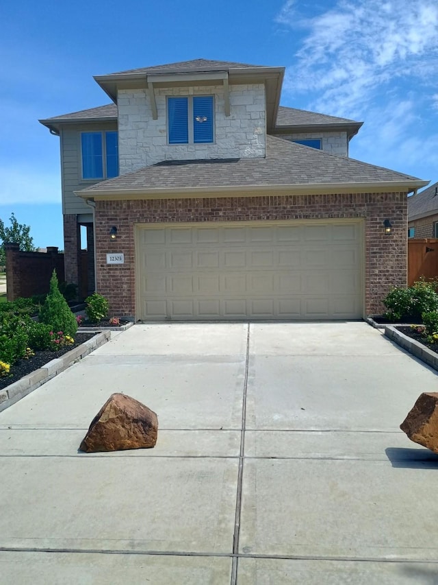 12303 Sterling Oak Dr, Humble, TX 77044 - view of front of property with brick siding, driveway, and roof with shingles