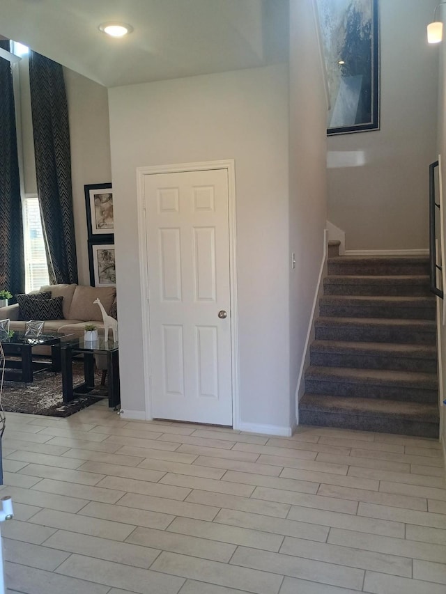12303 Sterling Oak Dr, Humble, TX 77044 - stairway with baseboards and recessed lighting