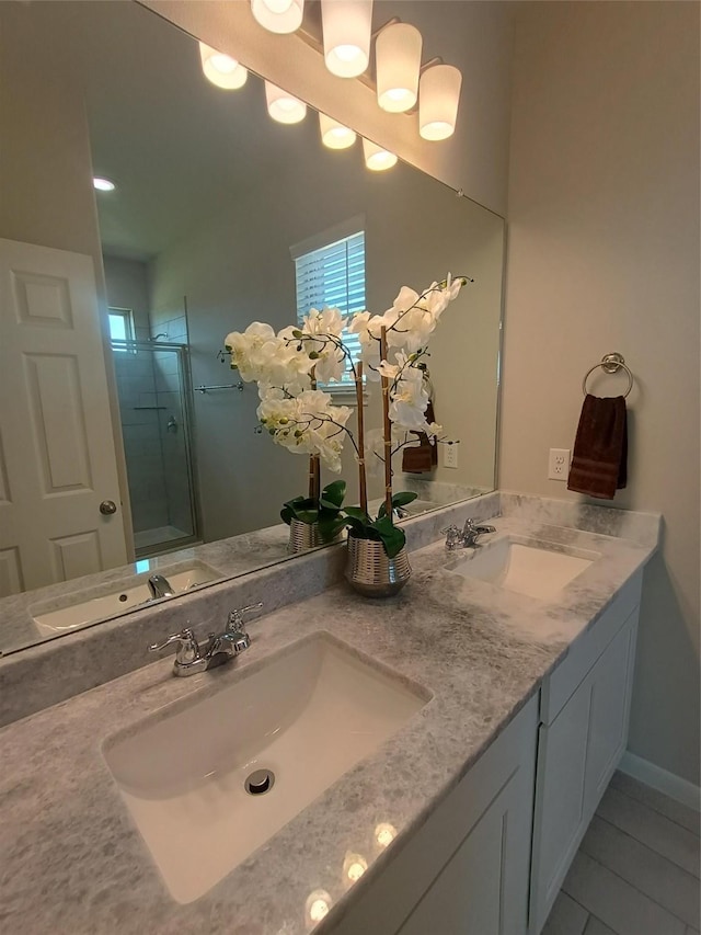 12303 Sterling Oak Dr, Humble, TX 77044 - bathroom with double vanity, a shower stall, and tile patterned floors
