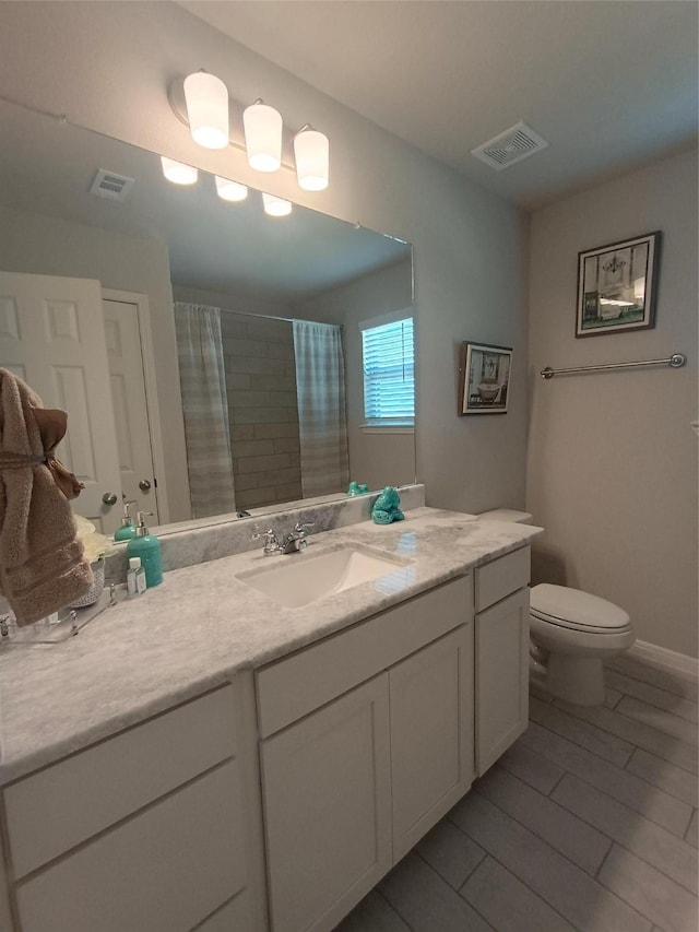 12303 Sterling Oak Dr, Humble, TX 77044 - bathroom with toilet, vanity, and a shower with curtain