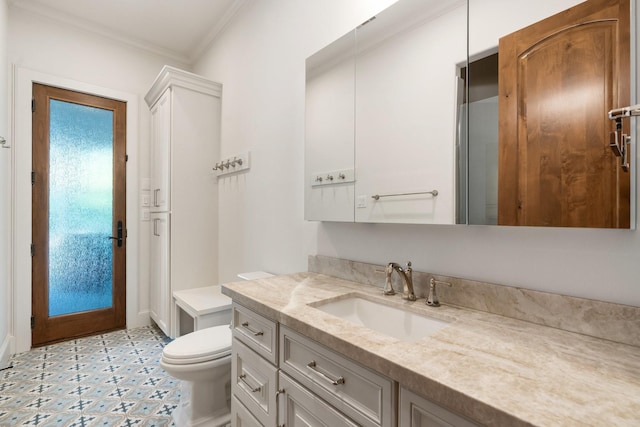 bathroom with vanity, ornamental molding, toilet, baseboards, and tile patterned floors