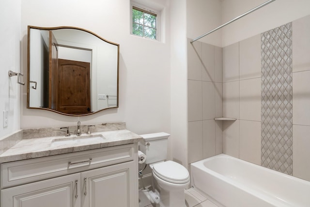 bathroom featuring vanity, washtub / shower combination, and toilet
