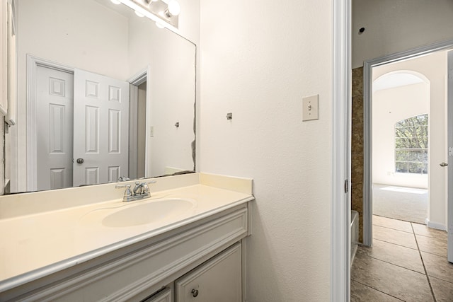 full bath with tile patterned floors and vanity