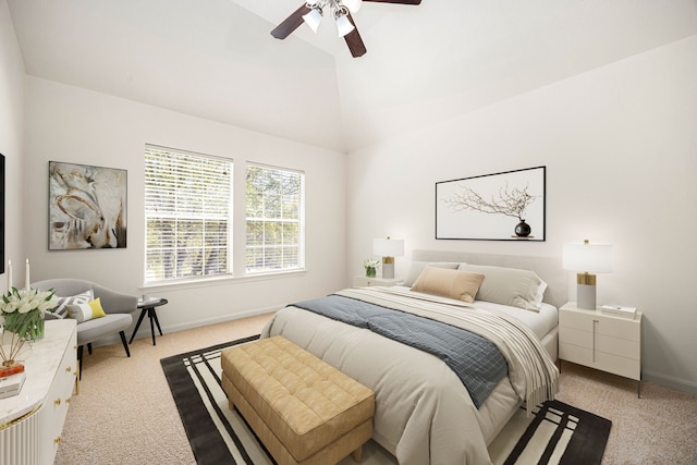 bedroom featuring baseboards, a ceiling fan, high vaulted ceiling, and light colored carpet