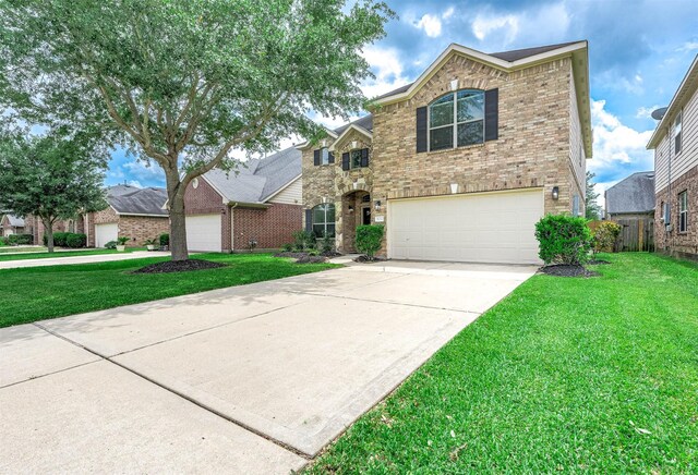 traditional home featuring a front lawn, brick siding, and a garage