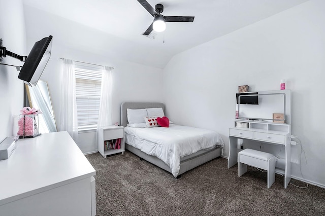 carpeted bedroom featuring vaulted ceiling, baseboards, and a ceiling fan
