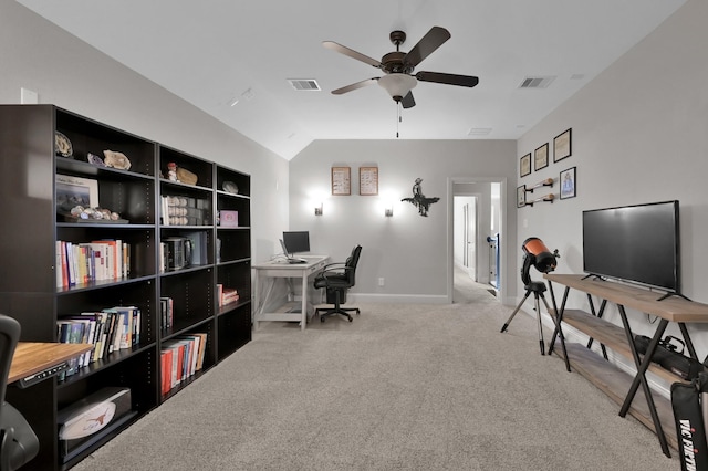 carpeted home office with ceiling fan, baseboards, and vaulted ceiling