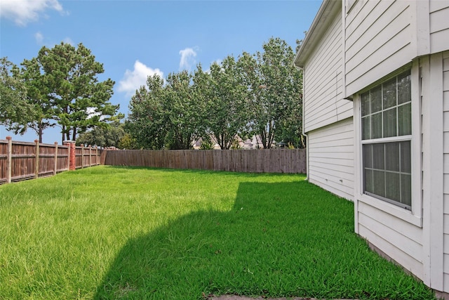 view of yard with a fenced backyard