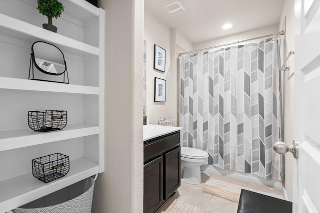 bathroom featuring visible vents, tile patterned flooring, vanity, curtained shower, and toilet