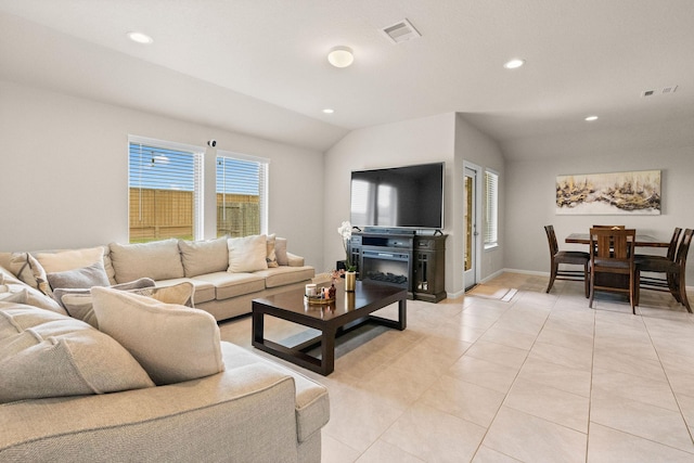 living room with light tile patterned floors, lofted ceiling, recessed lighting, and visible vents