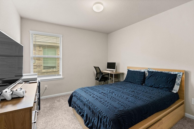 carpeted bedroom with baseboards