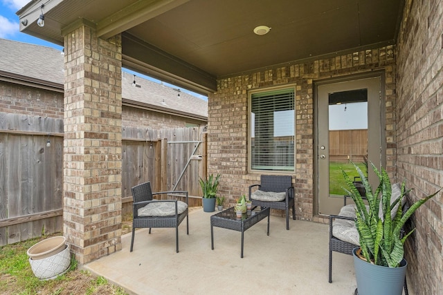 view of patio featuring fence