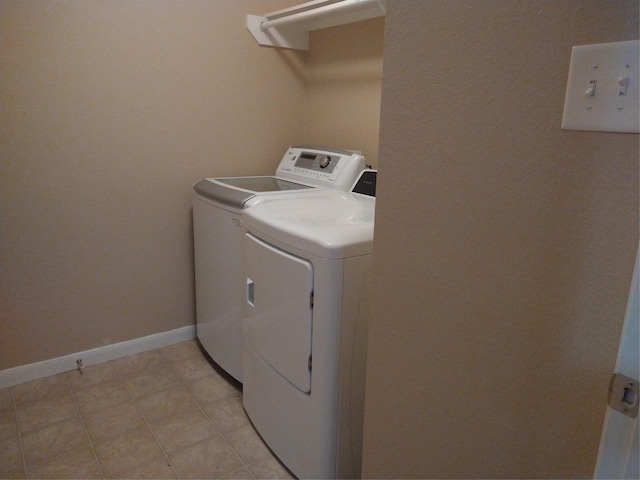 811 Sweet Flower Dr, Houston, TX 77073 - washroom featuring washing machine and dryer and baseboards