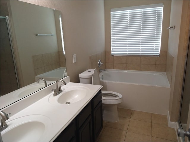 811 Sweet Flower Dr, Houston, TX 77073 - bathroom featuring toilet, a garden tub, tile patterned flooring, double vanity, and a shower stall