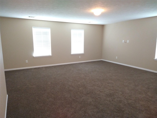 811 Sweet Flower Dr, Houston, TX 77073 - unfurnished room featuring baseboards and dark colored carpet