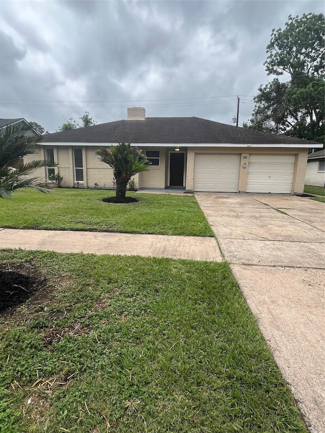 ranch-style house featuring concrete driveway, brick siding, a front lawn, and an attached garage