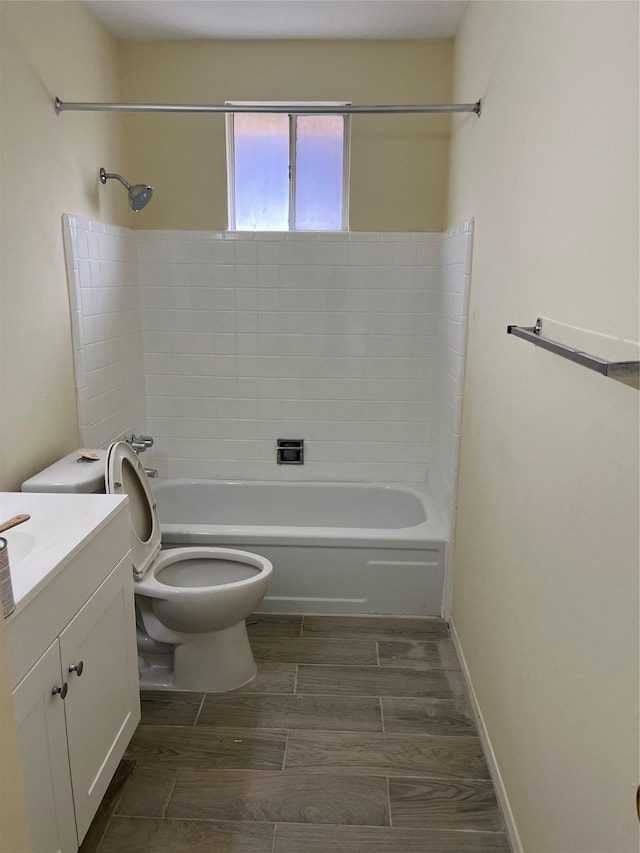 full bathroom featuring toilet, vanity, shower / tub combination, and wood finish floors