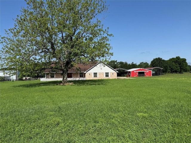 13796 County Road 318, Navasota, TX 77868 - view of green lawn featuring an outdoor structure and a pole building