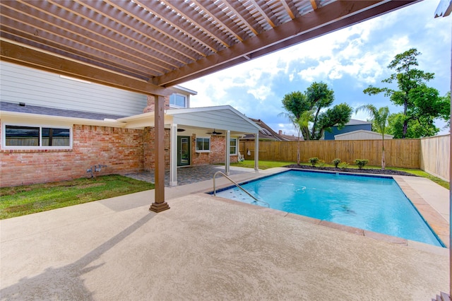 view of pool featuring a pergola, a fenced backyard, a fenced in pool, a patio area, and a ceiling fan