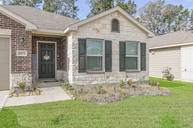 9971 Spring Creek Rd, Cleveland, TX 77327 - view of front of house featuring brick siding, a garage, a shingled roof, and a front lawn