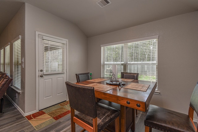 9971 Spring Creek Rd, Cleveland, TX 77327 - dining room featuring baseboards, lofted ceiling, wood finished floors, and visible vents