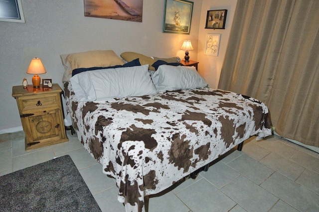 402 E Smith St, Brazoria, TX 77422 - bedroom with tile patterned floors