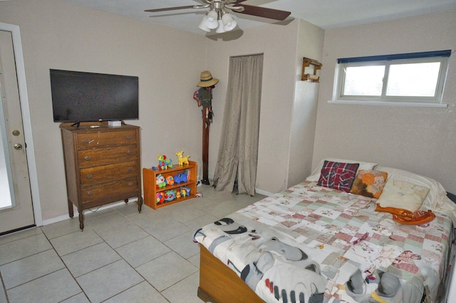 402 E Smith St, Brazoria, TX 77422 - bedroom with light tile patterned flooring and ceiling fan