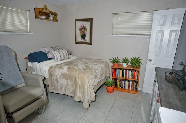 402 E Smith St, Brazoria, TX 77422 - bedroom with light tile patterned floors