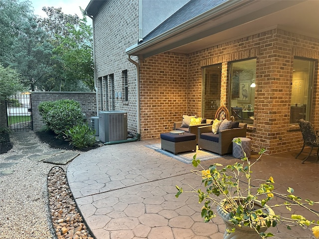 1302 Royal Sands Ln, Houston, TX 77345 - view of patio featuring a gate, central AC, and an outdoor hangout area
